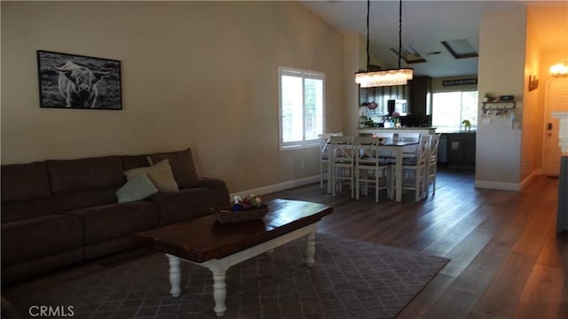 6003 Bluewater Bay Ct, Bakersfield, CA 93312 - living room with baseboards, vaulted ceiling, and dark wood-style floors
