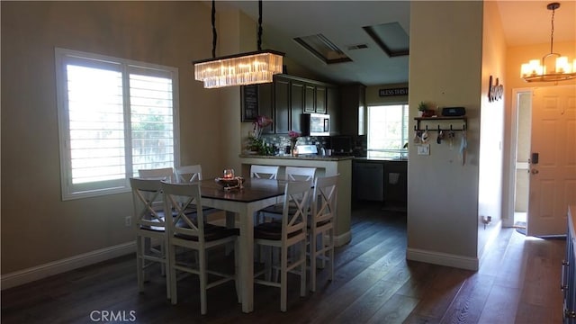 6003 Bluewater Bay Ct, Bakersfield, CA 93312 - dining space with a chandelier, dark wood-style flooring, baseboards, and high vaulted ceiling