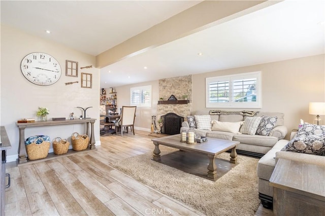 27573 Santa Clarita Rd, Saugus, CA 91350 - living area featuring wood finished floors, baseboards, a stone fireplace, and recessed lighting