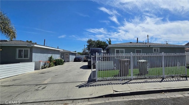 352 W Peach St, Compton, CA 90222 - view of front facade with a fenced front yard, stucco siding, and concrete driveway