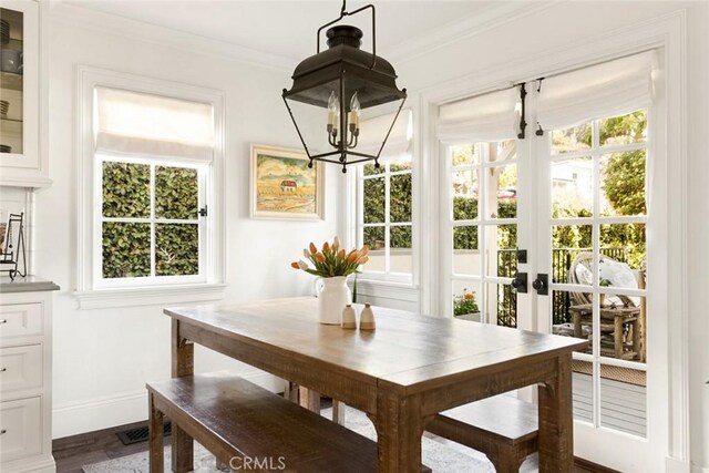 326 Ruby St, Laguna Beach, CA 92651 - dining space featuring a chandelier, baseboards, ornamental molding, dark wood-style floors, and french doors