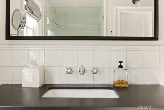 326 Ruby St, Laguna Beach, CA 92651 - bathroom featuring a sink, backsplash, and a shower