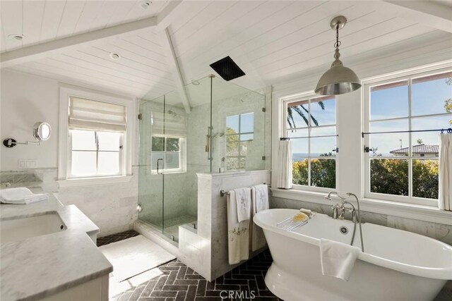 326 Ruby St, Laguna Beach, CA 92651 - bathroom featuring brick flooring, a marble finish shower, a freestanding bath, vanity, and tile walls