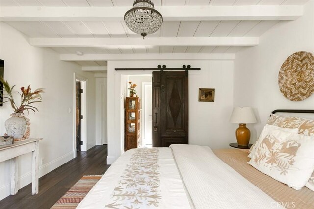 326 Ruby St, Laguna Beach, CA 92651 - bedroom with beam ceiling, dark wood finished floors, baseboards, and a barn door