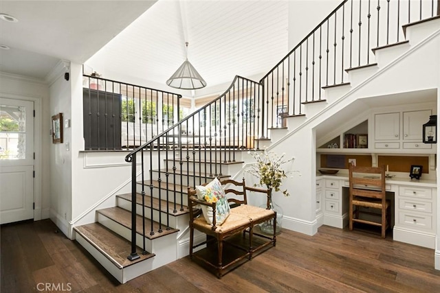 326 Ruby St, Laguna Beach, CA 92651 - stairs with built in study area, baseboards, wood finished floors, and crown molding