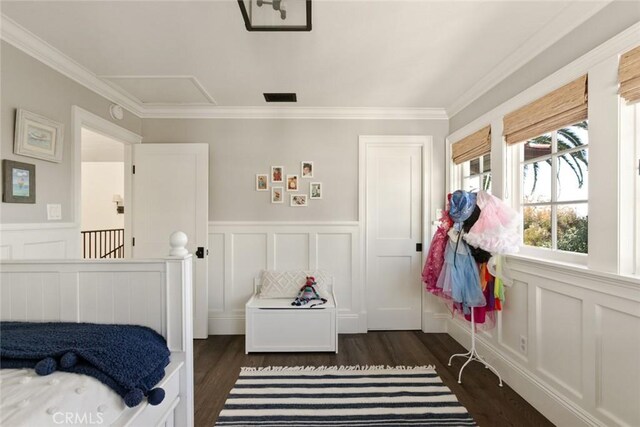 326 Ruby St, Laguna Beach, CA 92651 - bedroom with ornamental molding, attic access, dark wood-style floors, a wainscoted wall, and a decorative wall