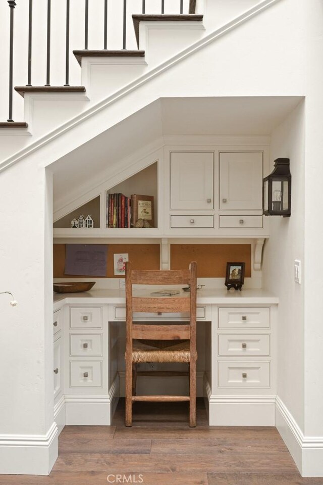 326 Ruby St, Laguna Beach, CA 92651 - office featuring built in desk, light wood-style flooring, and baseboards