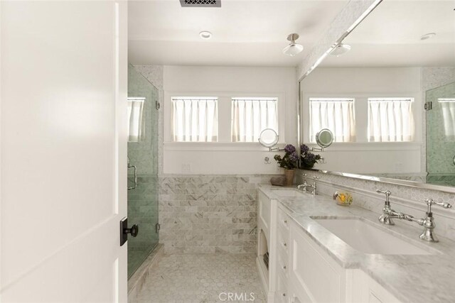 326 Ruby St, Laguna Beach, CA 92651 - full bathroom featuring a shower stall, double vanity, tile patterned floors, tile walls, and a wainscoted wall