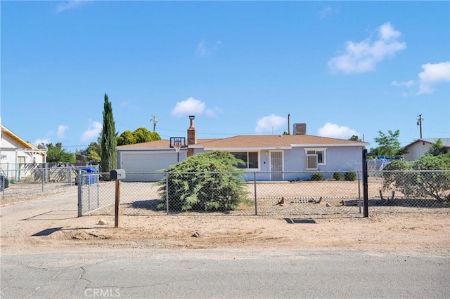 21822 Dotame Ave, Apple Valley, CA 92307 - ranch-style home with a fenced front yard, a garage, and stucco siding
