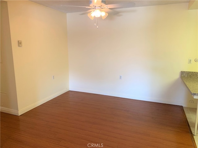 893 Ronda Sevilla Unit B, Laguna Woods, CA 92637 - empty room with ceiling fan, wood finished floors, and baseboards