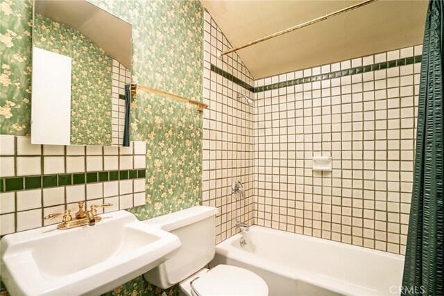 16292 Wishingwell, Huntington Beach, CA 92647 - bathroom with a sink, toilet, shower / bathtub combination, wallpapered walls, and tile walls