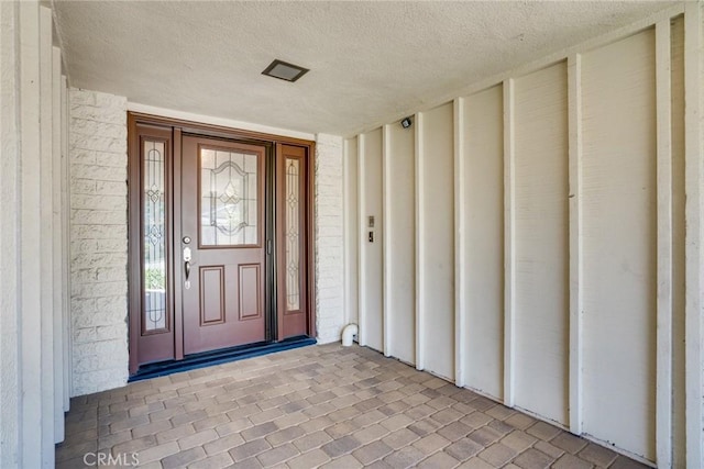 16292 Wishingwell, Huntington Beach, CA 92647 - doorway to property featuring board and batten siding