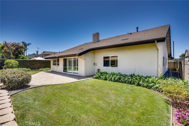 16292 Wishingwell, Huntington Beach, CA 92647 - rear view of house featuring a patio, a chimney, and stucco siding