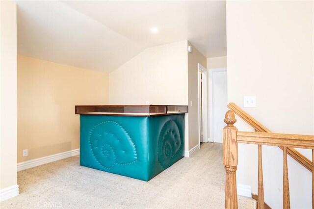 16292 Wishingwell, Huntington Beach, CA 92647 - bar area featuring lofted ceiling, carpet floors, and baseboards