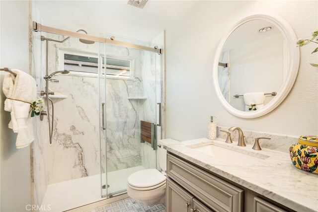 16292 Wishingwell, Huntington Beach, CA 92647 - full bathroom with vanity, a marble finish shower, and toilet