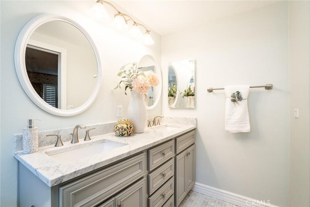 16292 Wishingwell, Huntington Beach, CA 92647 - bathroom featuring double vanity and baseboards