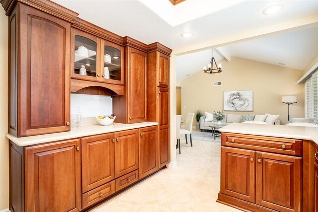 16292 Wishingwell, Huntington Beach, CA 92647 - kitchen with a chandelier, glass insert cabinets, light countertops, open floor plan, and recessed lighting