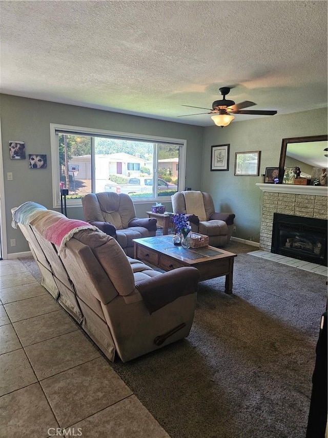 1371 Yokayo Dr, Ukiah, CA 95482 - living area featuring a fireplace with flush hearth, a textured ceiling, a ceiling fan, baseboards, and tile patterned floors