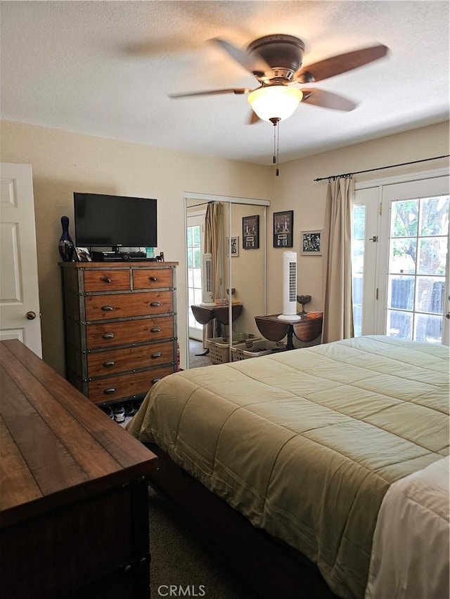 1371 Yokayo Dr, Ukiah, CA 95482 - bedroom featuring access to exterior, multiple windows, and a ceiling fan