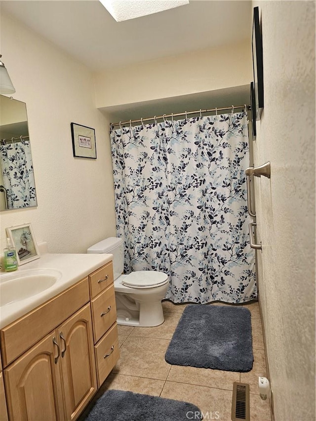 1371 Yokayo Dr, Ukiah, CA 95482 - full bathroom featuring vanity, toilet, tile patterned floors, and curtained shower