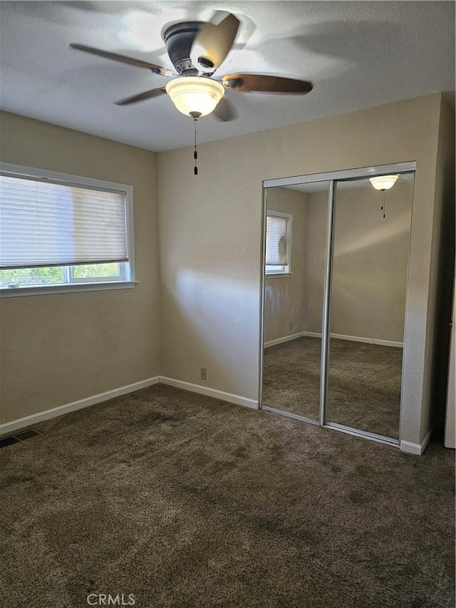 1371 Yokayo Dr, Ukiah, CA 95482 - unfurnished bedroom featuring carpet, a closet, ceiling fan, and baseboards