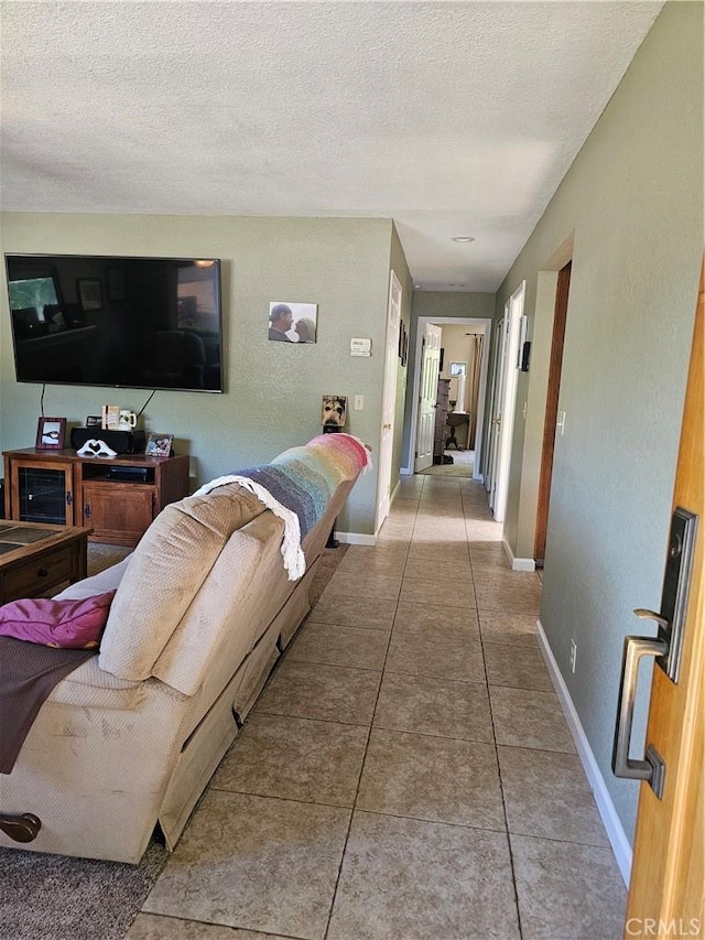 1371 Yokayo Dr, Ukiah, CA 95482 - tiled living room with baseboards and a textured ceiling