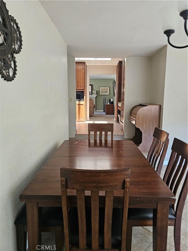 1371 Yokayo Dr, Ukiah, CA 95482 - dining space featuring a textured ceiling and light tile patterned floors