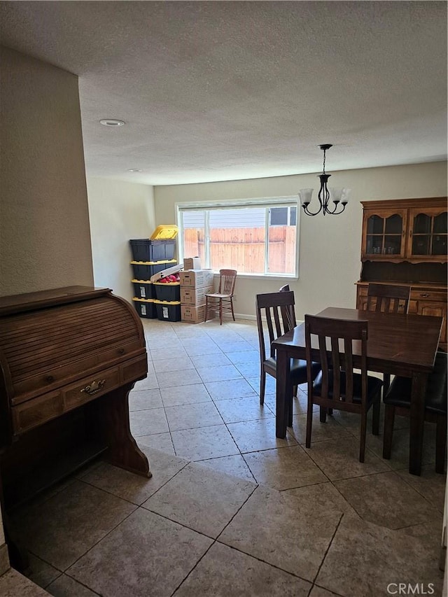 1371 Yokayo Dr, Ukiah, CA 95482 - dining space with a chandelier, a textured ceiling, and tile patterned floors