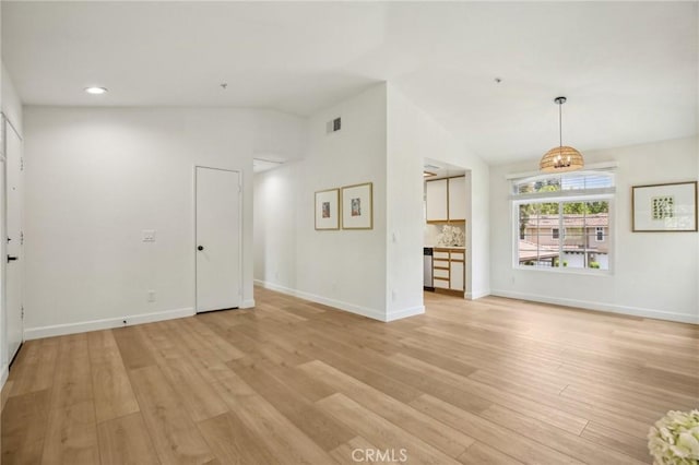 119 Gallery Way, Tustin, CA 92782 - unfurnished living room with lofted ceiling, light wood-style flooring, baseboards, and recessed lighting