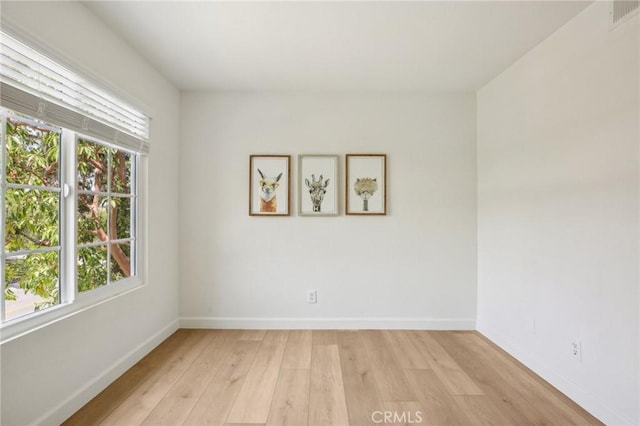 119 Gallery Way, Tustin, CA 92782 - spare room featuring healthy amount of natural light, baseboards, and light wood-type flooring