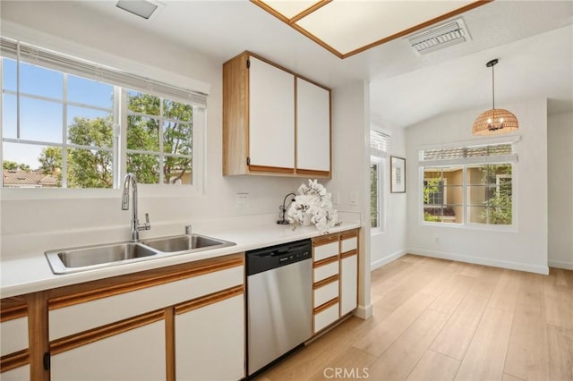 119 Gallery Way, Tustin, CA 92782 - kitchen with dishwasher, a sink, light wood-style floors, light countertops, and pendant lighting