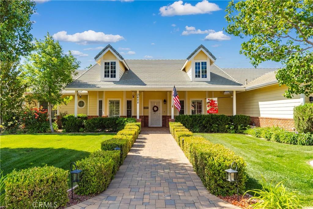 2608 Desert Rose Dr, Lancaster, CA 93536 - view of front of home featuring a front yard and brick siding