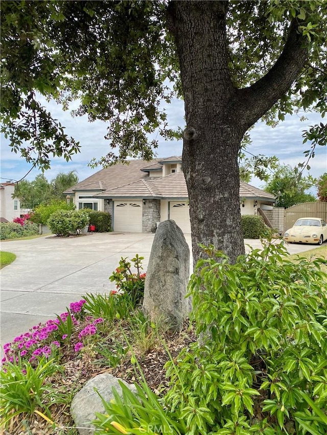 5218 Rocky Mountain Pl, Rancho Cucamonga, CA 91737 - view of front of house featuring concrete driveway and a garage