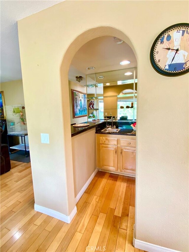 5218 Rocky Mountain Pl, Rancho Cucamonga, CA 91737 - bar area featuring arched walkways and light wood-style flooring