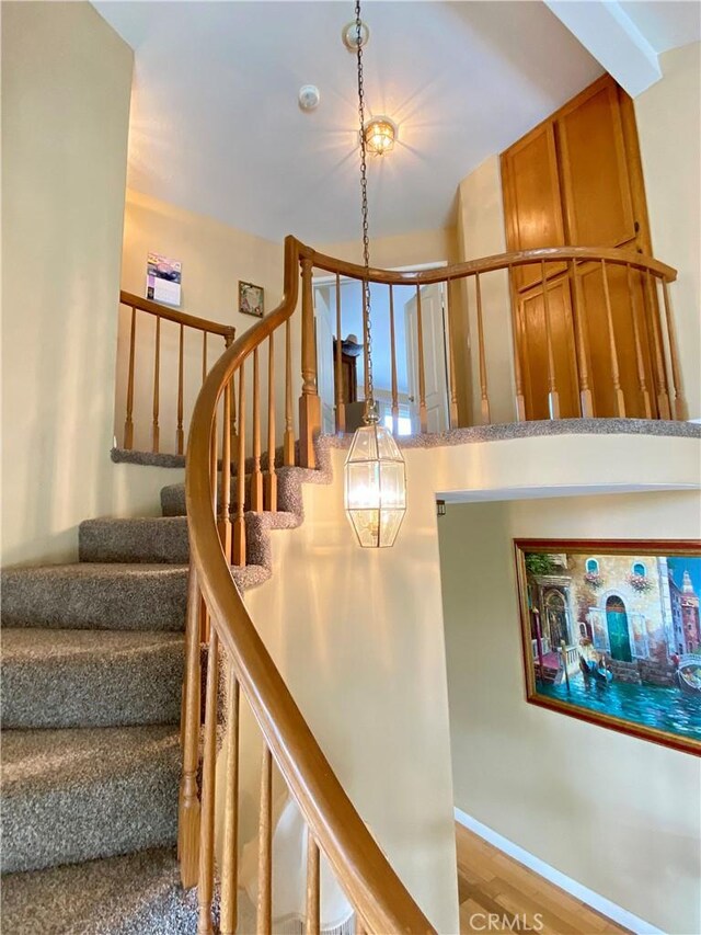 5218 Rocky Mountain Pl, Rancho Cucamonga, CA 91737 - stairway featuring wood finished floors and baseboards
