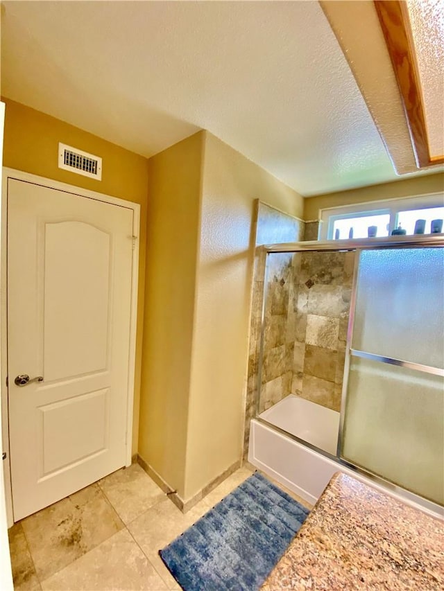 5218 Rocky Mountain Pl, Rancho Cucamonga, CA 91737 - full bathroom featuring combined bath / shower with glass door and tile patterned floors
