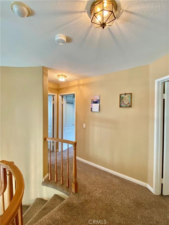 5218 Rocky Mountain Pl, Rancho Cucamonga, CA 91737 - corridor featuring carpet floors and stairs