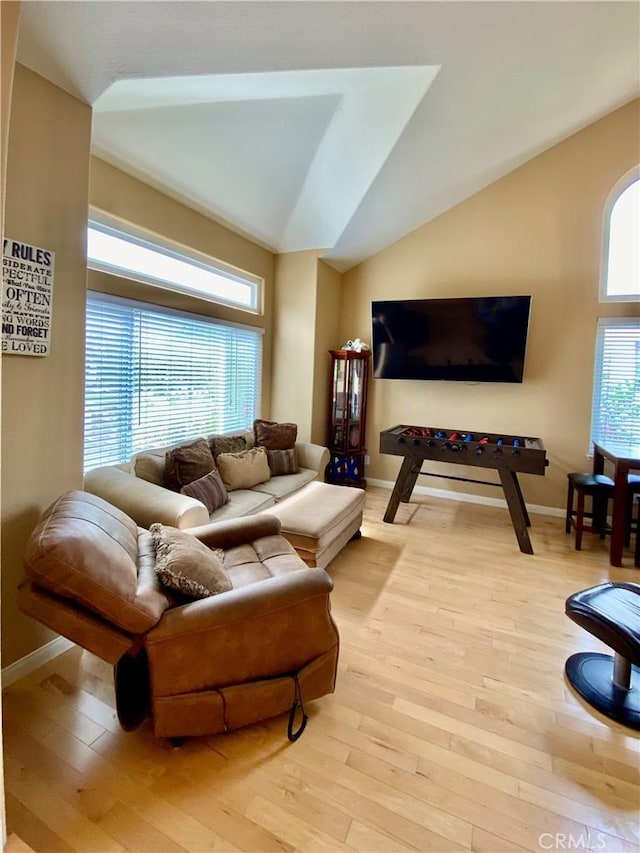 5218 Rocky Mountain Pl, Rancho Cucamonga, CA 91737 - living room featuring light wood-type flooring and lofted ceiling