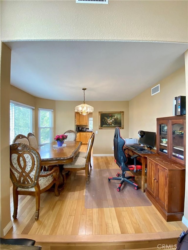 5218 Rocky Mountain Pl, Rancho Cucamonga, CA 91737 - dining space featuring light wood-style floors, a chandelier, and an office area