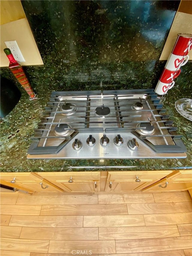 5218 Rocky Mountain Pl, Rancho Cucamonga, CA 91737 - kitchen view of dark countertops and stainless steel gas stovetop