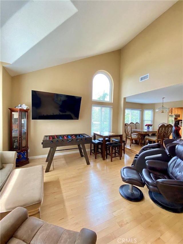 5218 Rocky Mountain Pl, Rancho Cucamonga, CA 91737 - living area with wood finished floors and high vaulted ceiling