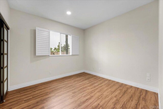 858 Via Barquero, San Marcos, CA 92069 - unfurnished room with wood finished floors, baseboards, and recessed lighting