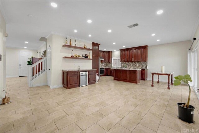 858 Via Barquero, San Marcos, CA 92069 - kitchen with open shelves, decorative backsplash, crown molding, recessed lighting, and reddish brown cabinets