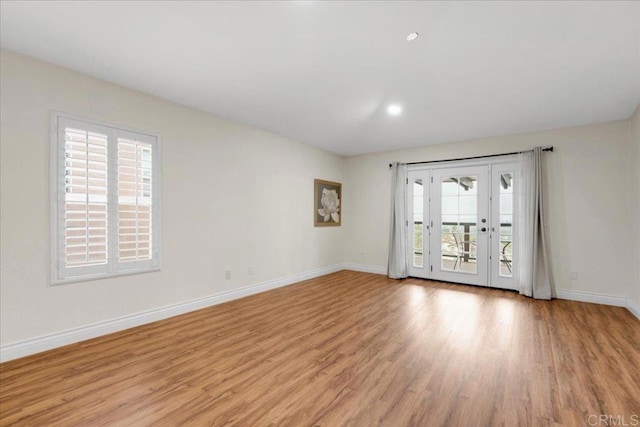 858 Via Barquero, San Marcos, CA 92069 - unfurnished room with light wood-style flooring, baseboards, and french doors