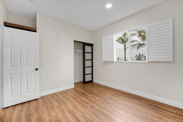 858 Via Barquero, San Marcos, CA 92069 - unfurnished bedroom featuring light wood finished floors, baseboards, a closet, and recessed lighting