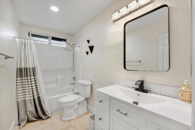858 Via Barquero, San Marcos, CA 92069 - bathroom featuring toilet, vanity, baseboards, shower / bathtub combination with curtain, and tile patterned floors