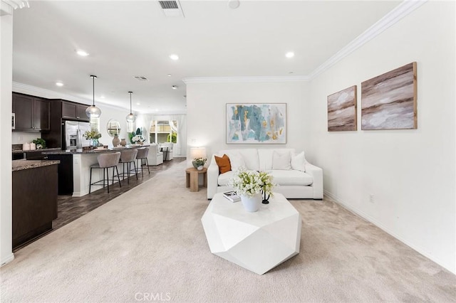 15975 Osprey Ave, Chino, CA 91708 - living area featuring recessed lighting, light colored carpet, crown molding, and baseboards