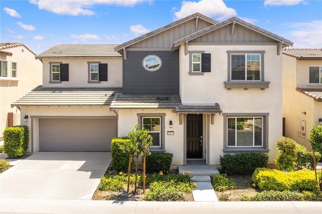 15975 Osprey Ave, Chino, CA 91708 - view of front of property with stucco siding, an attached garage, concrete driveway, and a tile roof