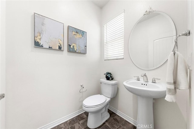 15975 Osprey Ave, Chino, CA 91708 - half bathroom with baseboards, toilet, and a sink