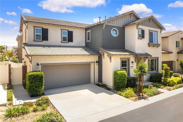 15975 Osprey Ave, Chino, CA 91708 - view of front of home featuring an attached garage, stucco siding, and driveway